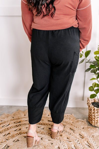 Cropped Tulip Hem Dressy Cargo Pants In Jet Black