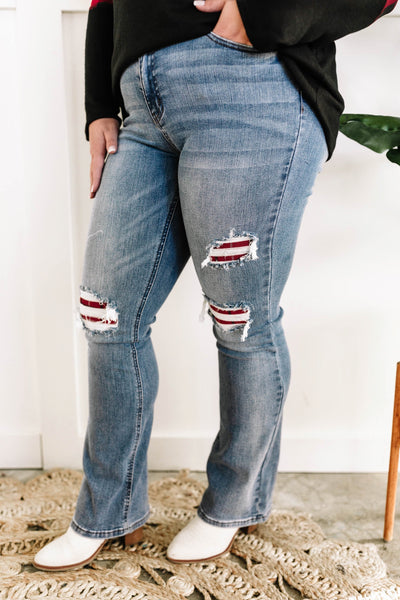 Mid Rise Bootcut Judy Blue Jeans With Plaid Patch Detail.
