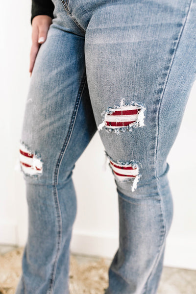 Mid Rise Bootcut Judy Blue Jeans With Plaid Patch Detail.