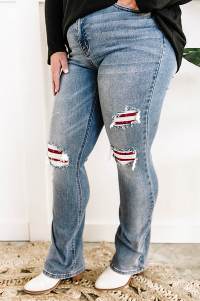 Mid Rise Bootcut Judy Blue Jeans With Plaid Patch Detail.