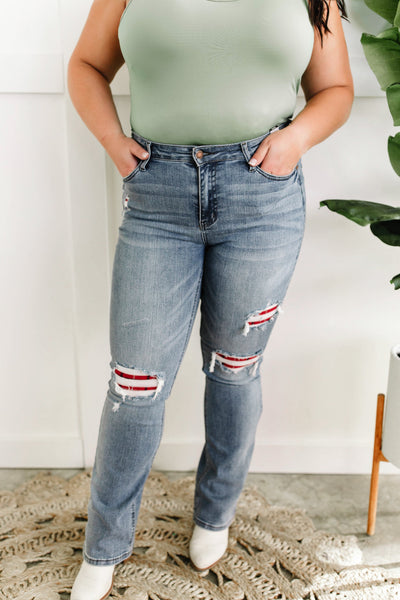 Mid Rise Bootcut Judy Blue Jeans With Plaid Patch Detail.